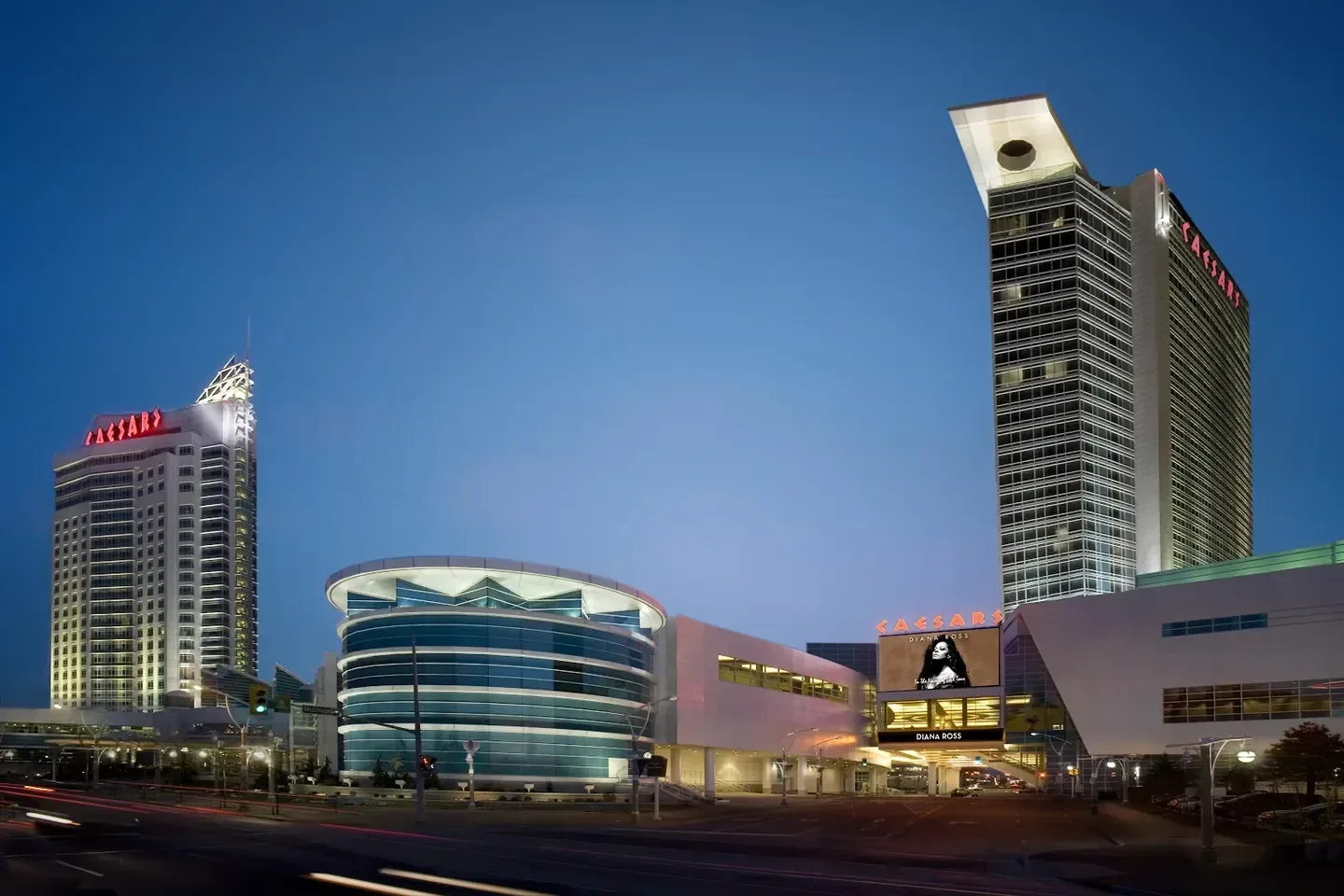Waterfront hotel exterior at dusk